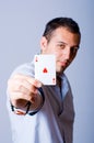 Poker player with an Ace of heart in his hand Royalty Free Stock Photo