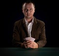 Poker player on a dark background