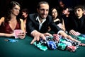 Poker player going all in pushing his chips