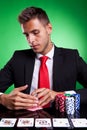 Poker player looking at his cards Royalty Free Stock Photo