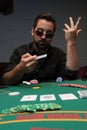 Poker player showing his dissatisfied face Royalty Free Stock Photo