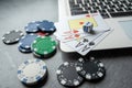 poker playing cards with casino chips on laptop keyboard for online gambling Royalty Free Stock Photo