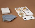 Poker playing cards. Poker set with isolated cards on brown background. Royalty Free Stock Photo