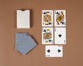 Poker playing cards. Poker set with isolated cards on brown background. Royalty Free Stock Photo