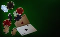 Poker playing chips and cards flying in the air on a green background, aces of hearts and clubs. Levitation. Copy space Royalty Free Stock Photo