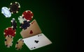 Poker playing chips and cards flying in the air on a green background. Aces of hearts and clubs. Levitation. Copy space Royalty Free Stock Photo