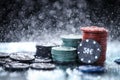 Poker playing chips on a green table and black background under the water drops. Online gambling. Royalty Free Stock Photo