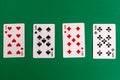 Poker quads playing card, green background Royalty Free Stock Photo
