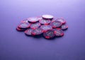 Poker red and black chips on grey background Royalty Free Stock Photo