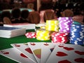 Poker royal flush hand and casino hands standing on poker table. 3D illustration Royalty Free Stock Photo