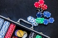 Poker set in a metallic case on a grey table top view copyspace