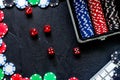 Poker set in a metallic case and keyboard on a grey table top view