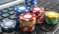 A poker set stacked on a laptop keyboard, in a pattern of electric blue chips Royalty Free Stock Photo