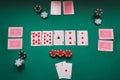 Poker table with different colored chips and cards Royalty Free Stock Photo