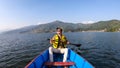 Pokhara - A man enjoying a boat tour on Phewa Lake Royalty Free Stock Photo