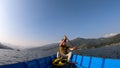 Pokhara - A man enjoying a boat tour on Phewa Lake Royalty Free Stock Photo