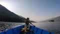 Pokhara - A man enjoying a boat tour on Phewa Lake Royalty Free Stock Photo
