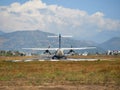 Pokhara, Nepal - April 13, 2019: A plane of local, Nepalese airlines on the runway of the airport in Pokhara is