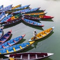 Pokhara, Nepal - November 21, 2015: Man rowing in the boat on Phewa lake in Pokhara.