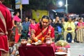 Nepalese Hindu priest performing Aarti ceremony at the lakeside in Pokhara, Nepal