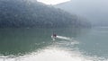 Pokhara, Nepal - November 20, 2015: Tourists rowing on a boat across Phewa lake