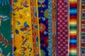 POKHARA, NEPAL - OCTOBER 06 2017: Close up of asorted collection of colorful typical traditional handmade fabrics inside