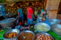 POKHARA, NEPAL OCTOBER 10, 2017: Close up of asorted food, noodles, lettuce and eggs inside of metallic trays in a