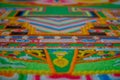 POKHARA, NEPAL - OCTOBER 06 2017: Close up of a detailed and colorful typical handmade carved structure in the ground of
