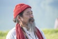 POKHARA, NEPAL - OCTOBER 07, 2016 : Tibetan Lama conducts classes with sunsurfers people on meditation and yoga near the lake