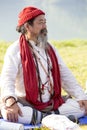 Tibetan Lama conducts classes with sunsurfers people on meditation and yoga near the lake in Pokhara, Nepal