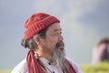 POKHARA, NEPAL - OCTOBER 07, 2016 : Tibetan Lama conducts classes with sunsurfers people on meditation and yoga near the lake