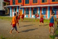 POKHARA, NEPAL - OCTOBER 06 2017: Unidentified Buddhist monk teenager playing soccer at the Sakya Tangyud monastery in