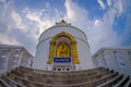 POKHARA, NEPAL, SEPTEMBER 04, 2017: Balanced on a narrow ridge high above Phewa Tal, the brilliant-white World Peace Royalty Free Stock Photo