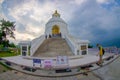 POKHARA, NEPAL, SEPTEMBER 04, 2017: Balanced on a narrow ridge high above Phewa Tal, the brilliant-white World Peace Royalty Free Stock Photo