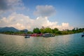 POKHARA, NEPAL - SEPTEMBER 04, 2017: Beautiful landscape of some buildings in the lakeshore with some boats in the Phewa