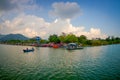 POKHARA, NEPAL - SEPTEMBER 04, 2017: Beautiful landscape of some buildings in the lakeshore with some boats in the Phewa