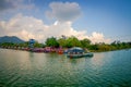 POKHARA, NEPAL - SEPTEMBER 04, 2017: Beautiful landscape of some buildings in the lakeshore with some boats in the Phewa