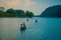 POKHARA, NEPAL - SEPTEMBER 04, 2017: Unidentified people enjoying a trip in a boat in the beautiful day in the Phewa tal