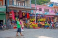 POKHARA, NEPAL, SEPTEMBER 04, 2017: Unidentified people walking at outdoors of street food market in dowtown near the