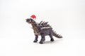 Polacanthus Dinosaur with Christmas hat on white background Royalty Free Stock Photo