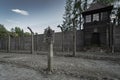 Poland, Auschwitz August 2, 2023. Concentration death camp. Observation tower, barbed wire fence and skull and crossbones plaque