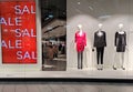 Poland, Bydgoszcz - January 13, 2022: Female mannequins near red SALE poster. Showcase of clothing store MOHITO