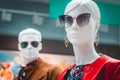 POLAND, BYDGOSZCZ - November 23, 2019: Female and male mannequins. Bright portrait of woman dummy in sunglasses and red jacket