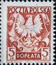 POLAND-CIRCA 1953 : A post stamp printed in Poland showing the heraldic animal of Poland the eagle on shield, circa