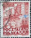 POLAND-CIRCA 1951 : A post stamp printed in Poland showing construction work with excavators in front of houses. Six Years Plan -