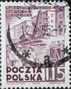 POLAND-CIRCA 1951 : A post stamp printed in Poland showing construction work with excavators in front of houses. Six Years Plan -