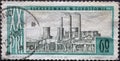 POLAND-CIRCA 1964 : A post stamp printed in Poland showing a drawing of a historic coal-fired power plant with cooling towers, chi