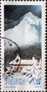 POLAND-CIRCA 1972 : A post stamp printed in Poland showing a romantic mountain landscape in the snow with lonely house in the vall