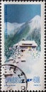 POLAND-CIRCA 1972 : A post stamp printed in Poland showing a romantic mountain landscape in the snow with lonely house in the vall