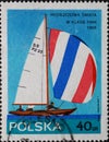 POLAND-CIRCA 1965 : A post stamp printed in Poland showing a sailboat with a spinnaker. World Sailing Championship in the Finn Din